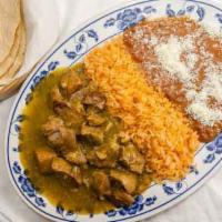 Chile Verde · Pork loin sautéed in a green tomatillo sauce. Served with Mexican rice, refried beans and a ...