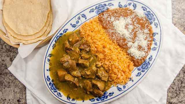 Chile Verde · Pork loin sautéed in a green tomatillo sauce. Served with Mexican rice, refried beans and a side of your choice of tortillas.