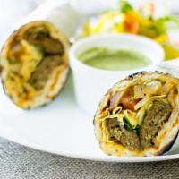 Lamb Seekh Kabab Wrap · Grilled lamb Seekh kabab wrapped in naan with sauce, onions, tomato and lettuce.