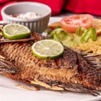 Whole Fried Tilapia · With  rice and beans,salad
