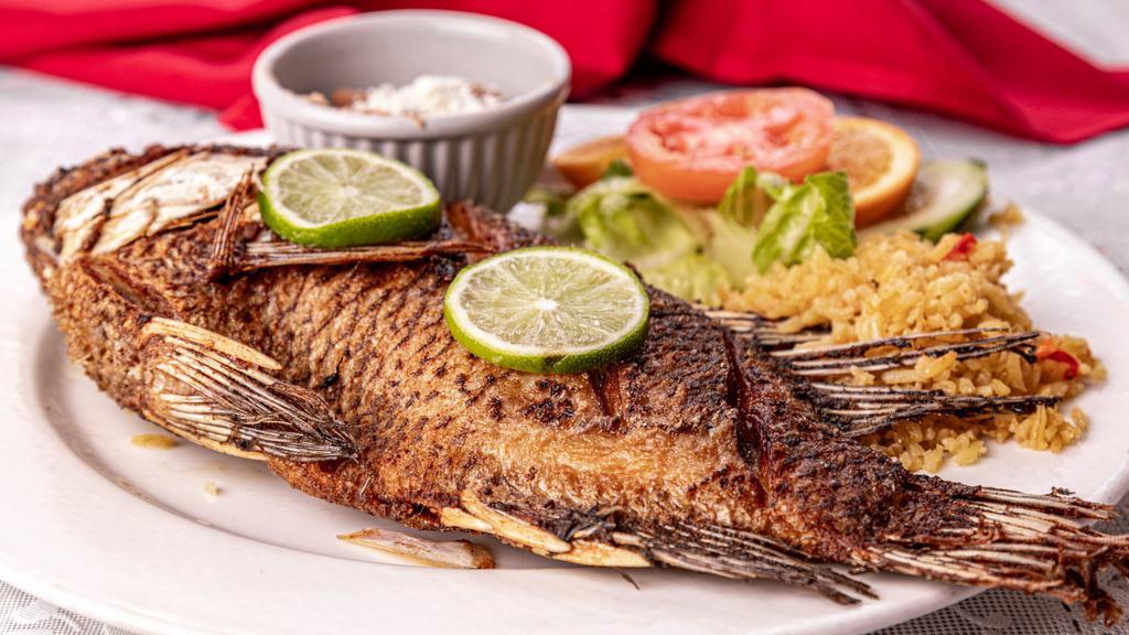 Whole Fried Tilapia · With  rice and beans,salad