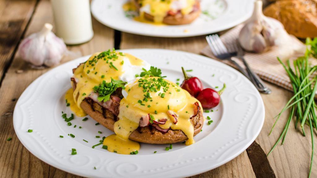 California Eggs Benedict · Avocado and Canadian bacon on English Muffin with two poached eggs and Hollandaise sauce.