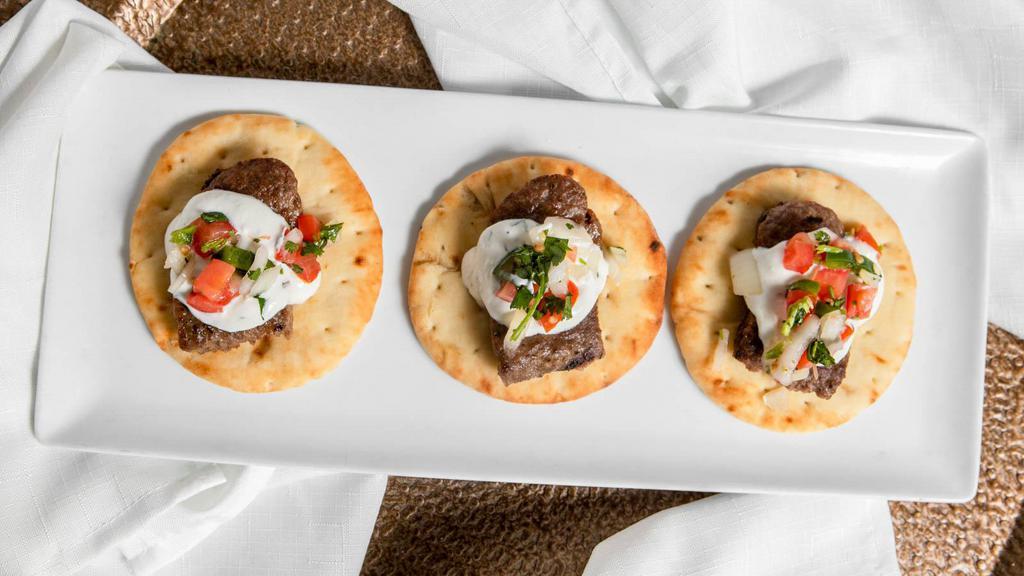 Mini Gyros (3 Pcs.) · Warm buttery pita with beef gyro  topped with dill tzatziki sauce and chopped salata