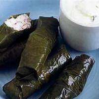 Greek Dolmathes · Grape leaves stuffed with lemon-dill rice, served with dill tzatziki sauce