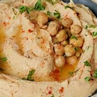 Garlic Hummus · creamy classic hummus topped with garlic parsely oil