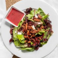 Spring Greens · Mixed greens with creamy goat cheese crumbles, dried cranberries, sweet candied pecans, and ...