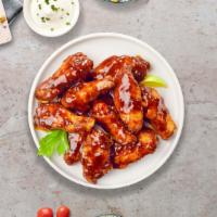BBQ Busters Wings · Fresh chicken wings fried until golden brown, and tossed in barbecue sauce. Served with a si...