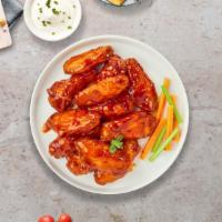 Follow The Buffalo Wings  · Fresh chicken wings fried until golden brown, and tossed in buffalo sauce. Served with a sid...
