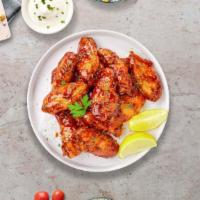 Sweet Glaze BBQ Wings · Fresh chicken wings fried until golden brown, and tossed in honey and barbecue sauce. Served...