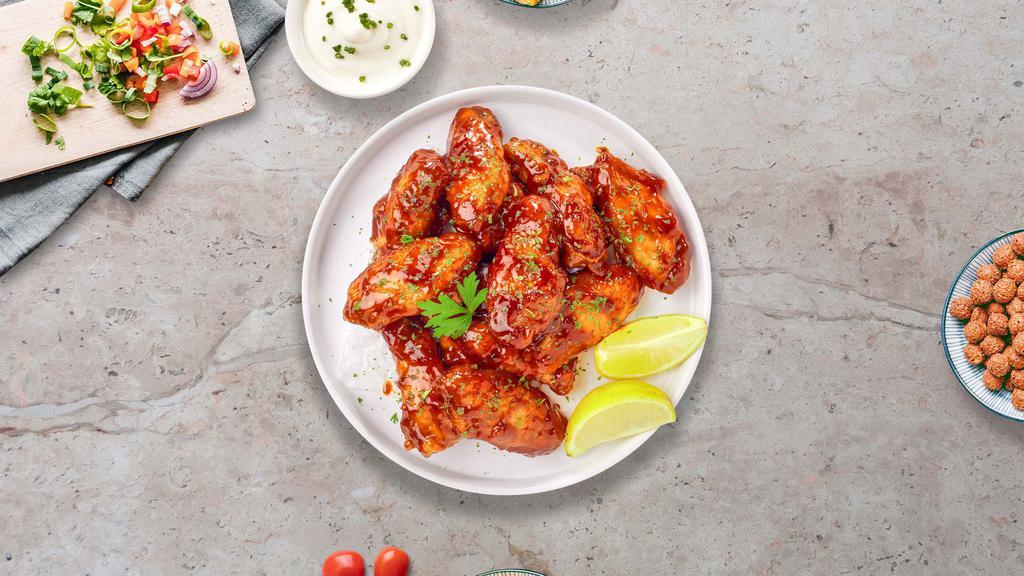 Sweet Glaze BBQ Wings · Fresh chicken wings fried until golden brown, and tossed in honey and barbecue sauce. Served with a side of ranch or bleu cheese.