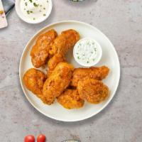 Habanero Haven Wings · Fresh chicken wings fried until golden brown, and tossed in mango habanero sauce. Served wit...