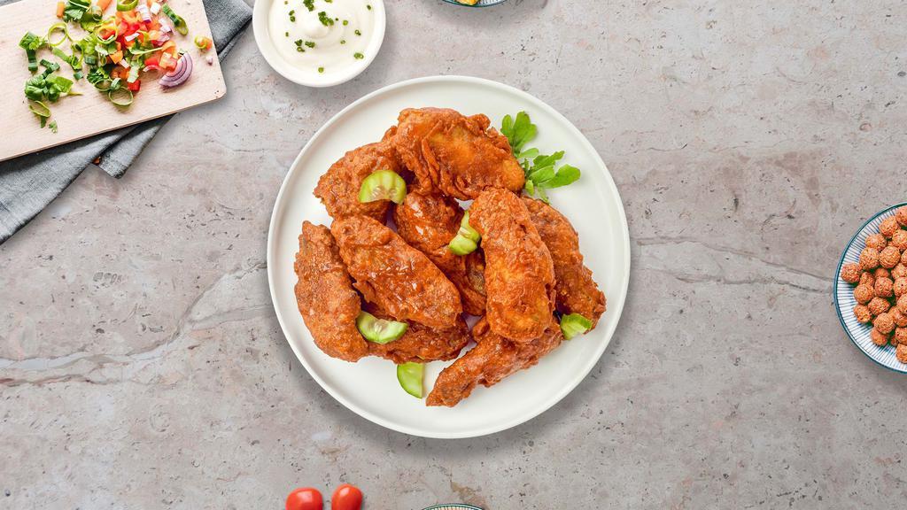 Hot Flames Wings · Fresh chicken wings fried until golden brown, and tossed in Nashville Hot Sauce. Served with a side of ranch or bleu cheese.