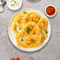 Over The Onion Rings · (Vegetarian) Sliced onions dipped in a light batter and fried until crispy and golden brown.