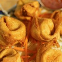 Crab Rangoon · Deep fried egg wonton stuffed with crab meat and cream cheese. Served with sweet and chili s...