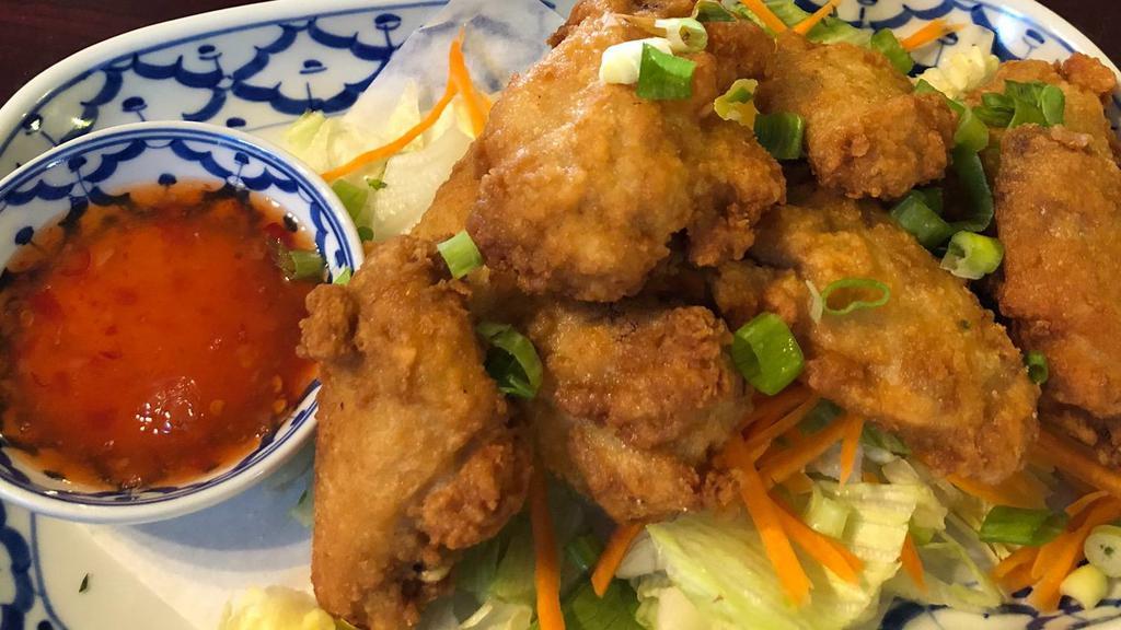 Wings · Fried chicken wings with sweet chili sauce.