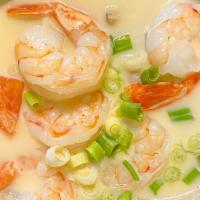 Tom Kha · Mild spicy and sour coconut soup with chili paste, lemongrass, kaffir lime leaves, galangal,...