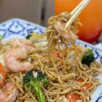 Garlic Noodles · Stir fried egg noodles with carrot, cabbage, broccoli, and garlic. Topped with Parmesan chee...