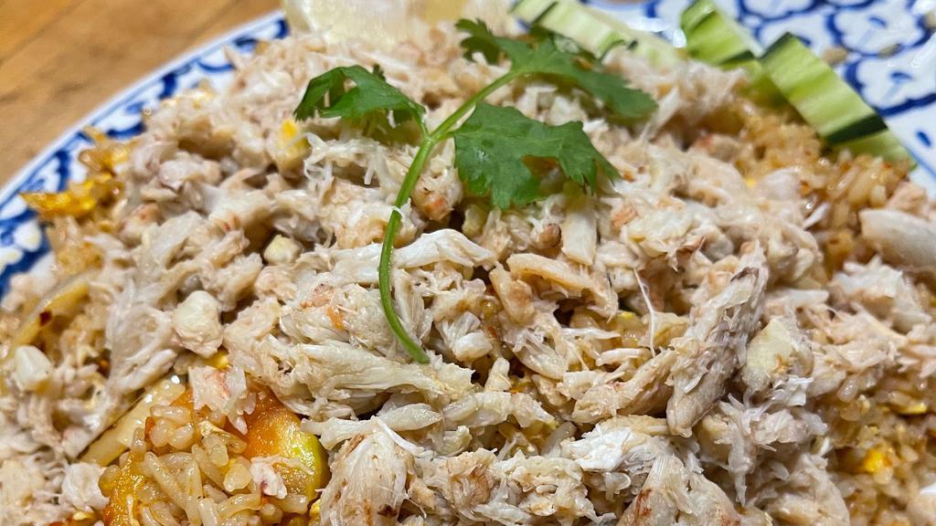 Crab Fried Rice · Thai style fried rice with real crab meat, onion, tomato, garlic and egg.