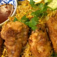 Yellow Curry Fried Rice · Fried rice with fried chicken wings, cashew nut, corn, pea, carrot, and egg seasoned with ye...