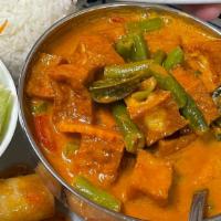 Panang Curry · Panang curry paste in coconut milk with green bean, peanut sauce, citrus leaves, and bell pe...