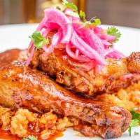  Adobo Braised Half Chicken · spanish rice,button mushrooms, pepers,pearl onio,potatoes,salsa criolla