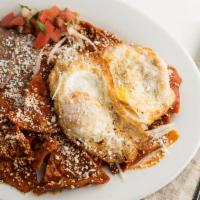 Chilaquiles in Green Tomatillo Sauce & Eggs · 2 free range eggs. Topped with onions and Queso Fresco. Serve with refried beans.