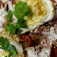 Chilaquiles in Red Guajillo Chile Sauce & Eggs · 2 free range eggs. Topped with onions and Queso Fresco. Serve with refried beans.