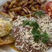 Huevos Divorciados · Two free range eggs topped with red and green salsa. Red potatoes, refried beans, Queso fres...