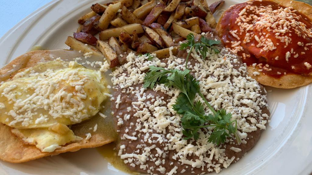 Huevos Divorciados · Two free range eggs topped with red and green salsa. Red potatoes, refried beans, Queso fresco and tortillas.