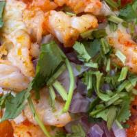 Tacos Gobernador · Sautéed shrimp and cheese on grilled corn tortillas, topped with red onions and cilantro
