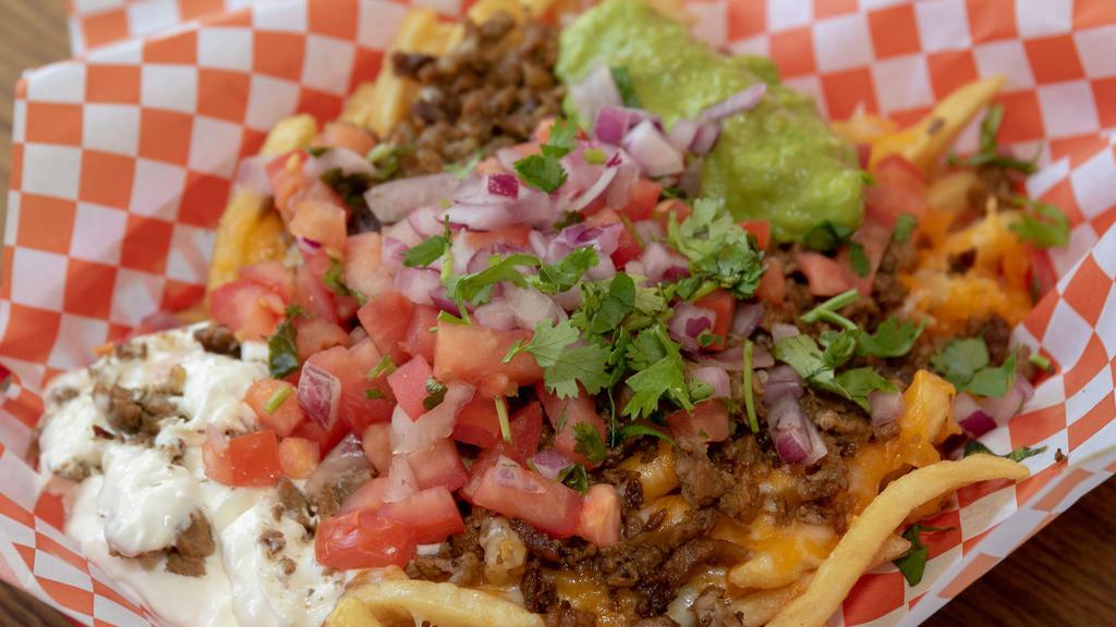 Birria Loaded Fries · French fries topped with beef Birria, jack cheese, cheddar cheese, sour cream, guacamole and pico de gallo