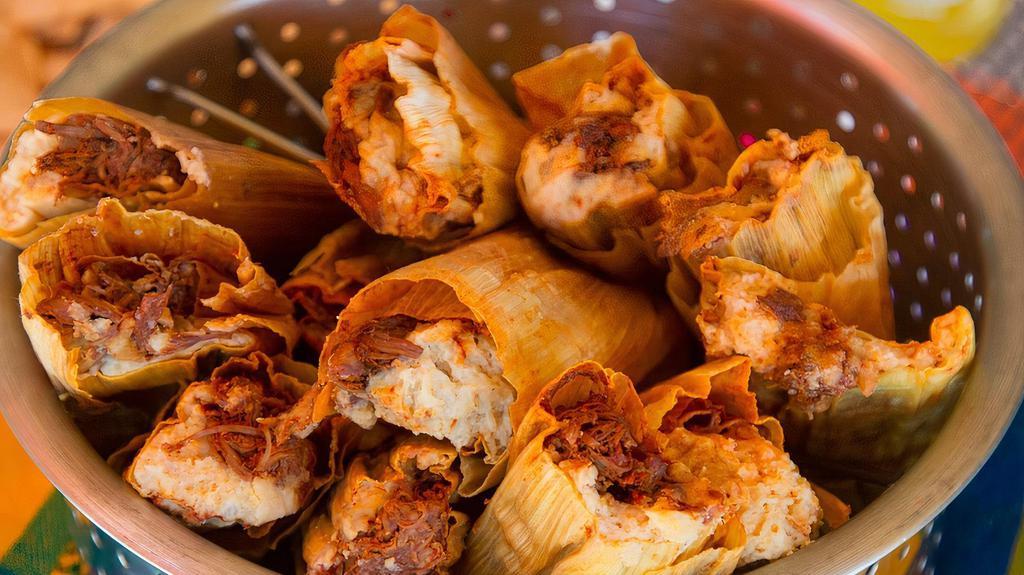 Vegetarian Tamales  · A dozen of our hand made vegetarian tamales. Stuffed with queso fresco, chiles and onions.