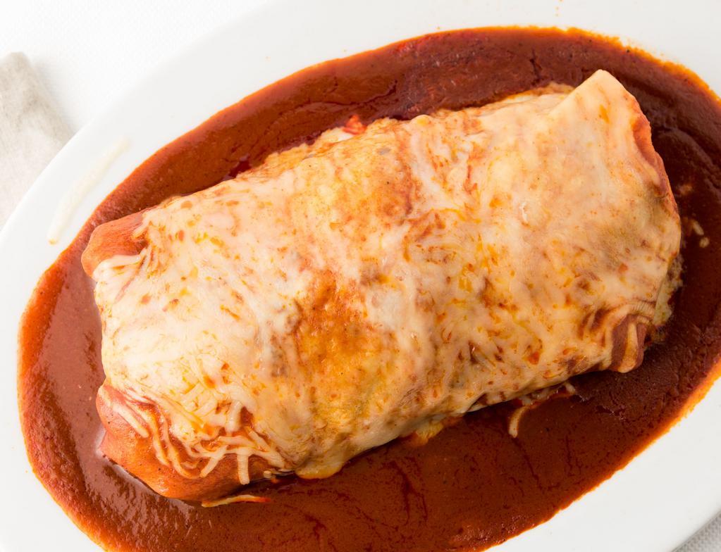 Mojados / Wet Burrito · Choice of meat. Choice of beans. Serve with tomato rice, salsa fresca, sour cream, and guacamole. Topped with red enchilada sauce or green tomatillo sauce and cheese.