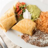 Chimichanga / Deep fried burrito · Stuffed with choice of meat and cheese. Serve with tomato rice, beans, sour cream, guac, and...