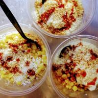 Esquites en vaso · Mexican street corn in a cup. Sweet corn, mayo, lime juice, Cotija cheese and chile powder.