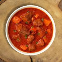 Greatest Goat Vindaloo · Goat cooked in a spicy pungent curry with potatoes.