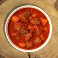 Vindaloo In Vain Lamb · Juice lamb cooked in a spicy pungent curry with potatoes.