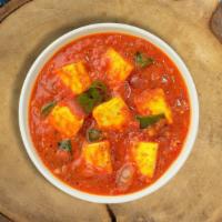 Kadai Keeper Paneer · Tender cottage cheese pieces stir fried with bell peppers, onions, & tomatoes in a light gravy