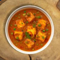 Matar Motive Paneer · Cubes of fresh cottage cheese and green peas cooked in a creamy tomato gravy.