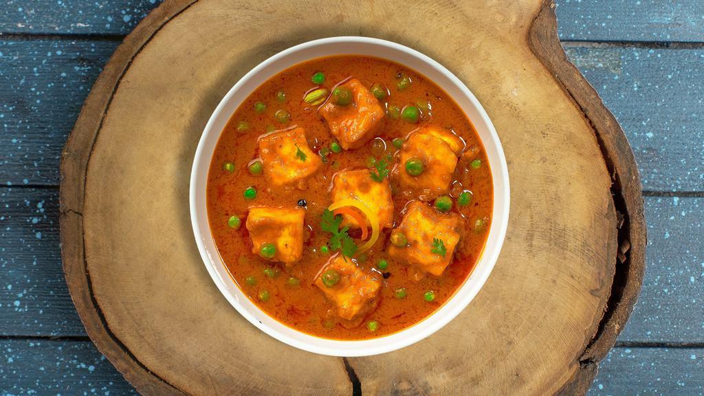 Matar Motive Paneer · Cubes of fresh cottage cheese and green peas cooked in a creamy tomato gravy.