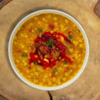Dial Dal Masala · Traditional Indian yellow lentil soup tempered with fried onion, tomato and special spices.