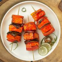 Always Achari Paneer Tikka · Fresh cubes of cottage cheese marinated in yoghurt and baked in a tandoor clay oven