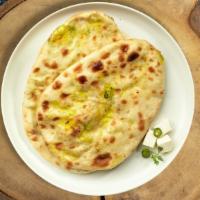 Purely Paneer Naan · Freshly baked bread stuffed with cottage cheese cooked in a clay oven