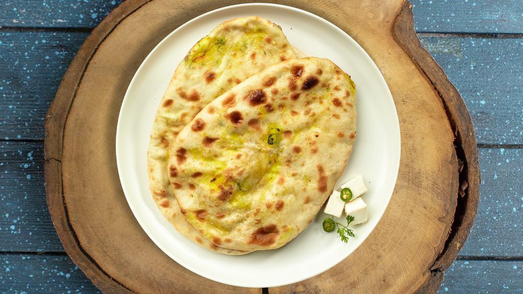 Purely Paneer Naan · Freshly baked bread stuffed with cottage cheese cooked in a clay oven