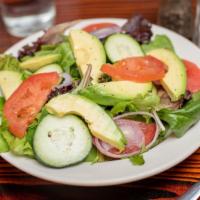 Mixed Green Salad · Mixed greens topped with tomatoes and cucumbers.
