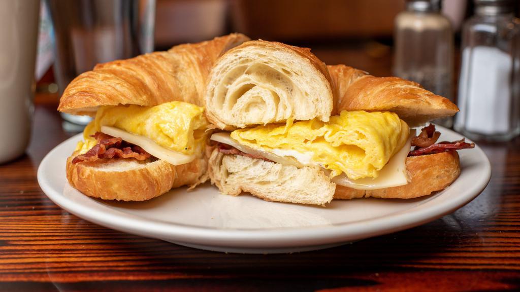 Breakfast Sandwich · Your choice of bread, meat, and cheese with a scrambled egg.