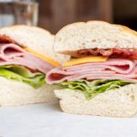 Black Forest Ham Sandwich · Served with lettuce, tomato, onion, pickles, mayonnaise, and mustard.