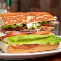 Chicken Club · Served with avocado, bacon, lettuce, cheese, tomato, onion, pickles, mayonnaise, mustard. Co...