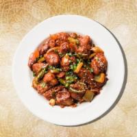 Sizzling Chili Chicken · Boneless chicken is marinated in Chinese sauces, fried until crispy with stir fried lots of ...