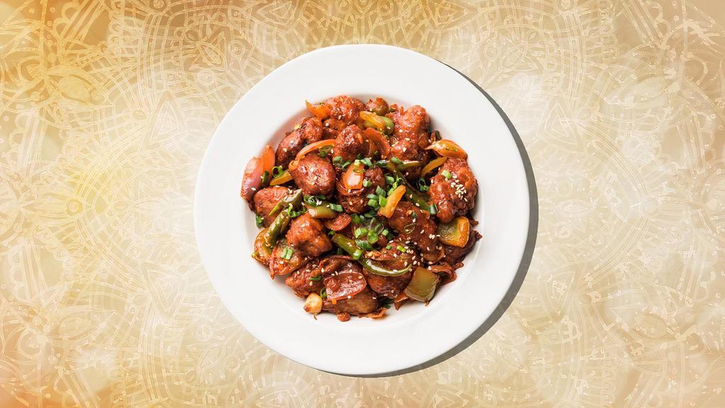 Sizzling Chili Chicken · Boneless chicken is marinated in Chinese sauces, fried until crispy with stir fried lots of ginger, garlic & onions